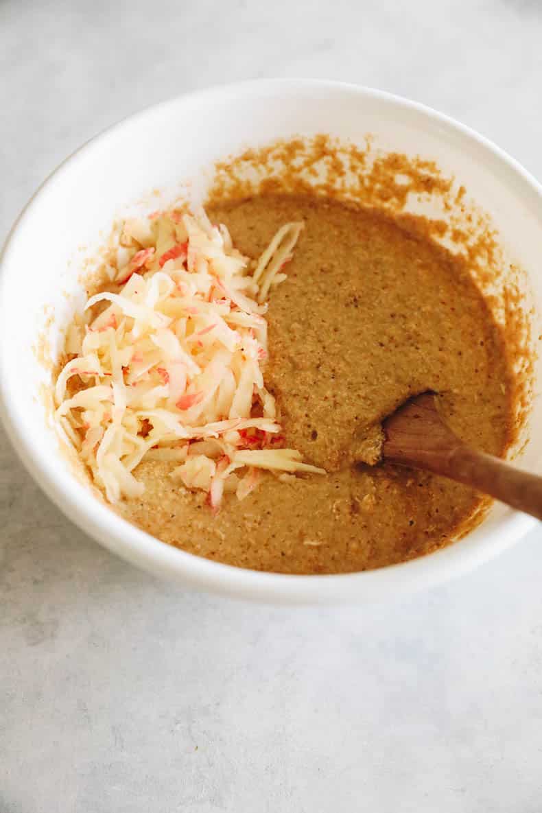 applesauce muffin batter in a large white mixing bowl.