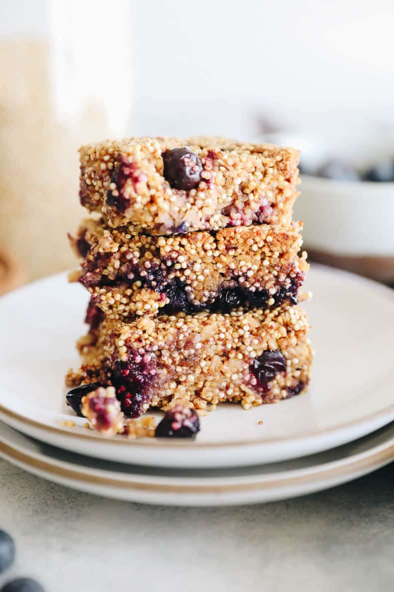3 blueberry quinoa bars stacked on top of each other.