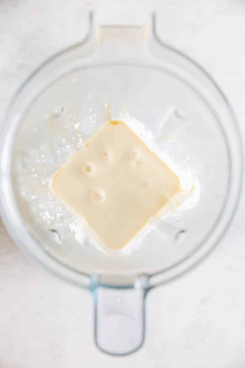 Cottage cheese and maple syrup blended in a blender.