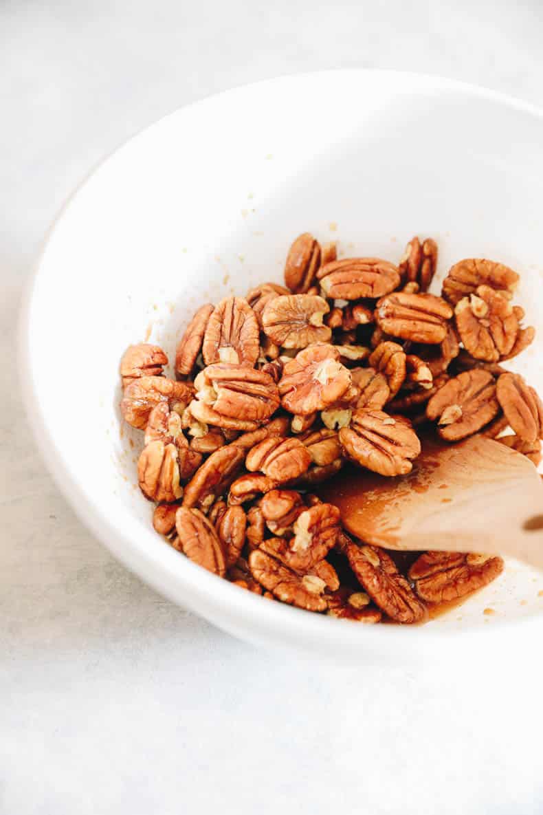 Raw pecans in maple syrup and spices