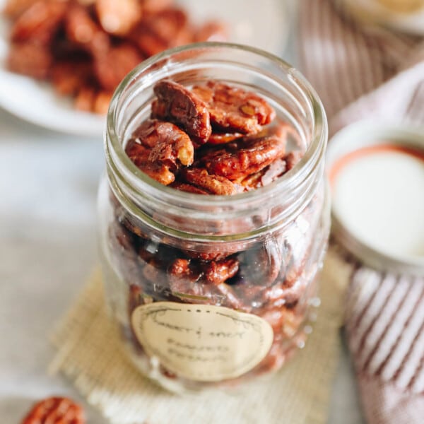 sweet and spicy roasted pecans in a mason jar